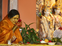 Her Holiness Amma Sri Karunamayi performs special prayers during the Rudra Abhishekam (a special puja where rice is offered to Lord Shiva) a...