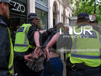 One anti-EDL protestor is arrested , in London, on June 24, 2017. A high pilice presence keeps apart the far-right English Defence League an...