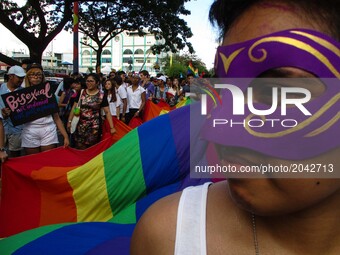LGBT (lesbian, gay, bisexual, and transgender) supporters and members participate during the annual LGBT Pride Parade in Marikina City, east...