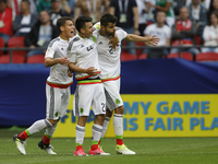 Nestor Araujo (R) of Mexico national team celebrates his goal with teammates Hector Moreno (L) and Hirving Lozano during the Group A - FIFA...