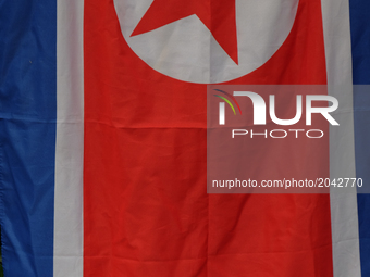 The North Korean flag held outside the US embassy. Six people from the Korean friendship association hold a protest against the US in Korea...