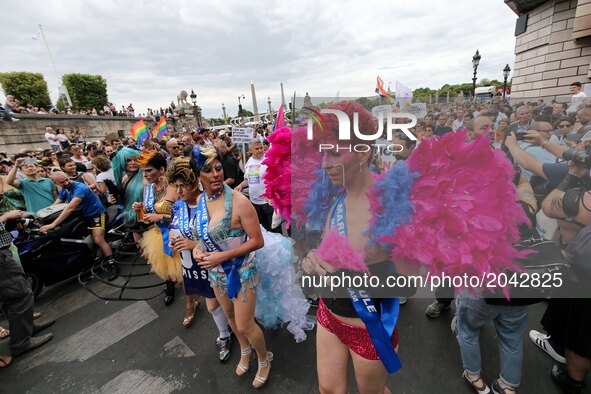 Costumed participants take part in the annual Gay Pride homosexual, bisexual and transgender visibility march on June 24, 2017 in Paris. 