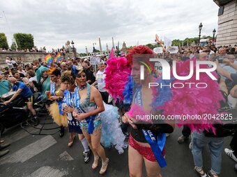 Costumed participants take part in the annual Gay Pride homosexual, bisexual and transgender visibility march on June 24, 2017 in Paris. (