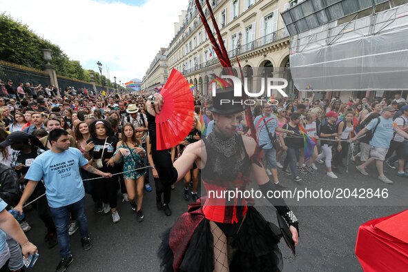 People take part in the annual Gay Pride homosexual, bisexual and transgender visibility march on June 24, 2017 in Paris. 
