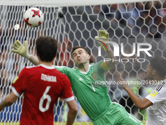 Igor Akinfeev (C) of Russia national team fails to save the ball shot by Nestor Araujo (not seen) during the Group A - FIFA Confederations C...