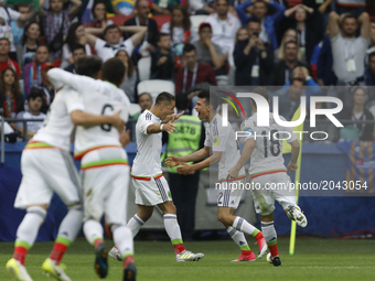 Hirving Lozano (2nd R) celebrates his goal with teammates during the Group A - FIFA Confederations Cup Russia 2017 match between Russia and...