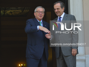 Prime minister Samaras and EU-Commission President Juncker in the office of the Greek PM, in Athens, on August 4, 2014. (