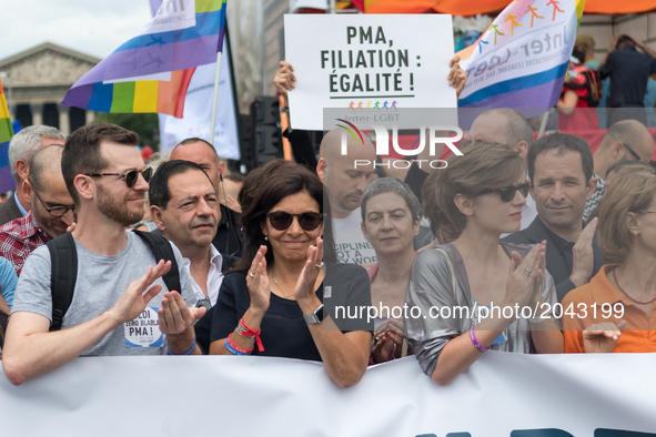 Paris' Mayor Anne Hidalgo (C) claps  during march Gay Pride 2015 in Paris, on June 24th 2017. 2017 marks the 40th anniversary of the first G...