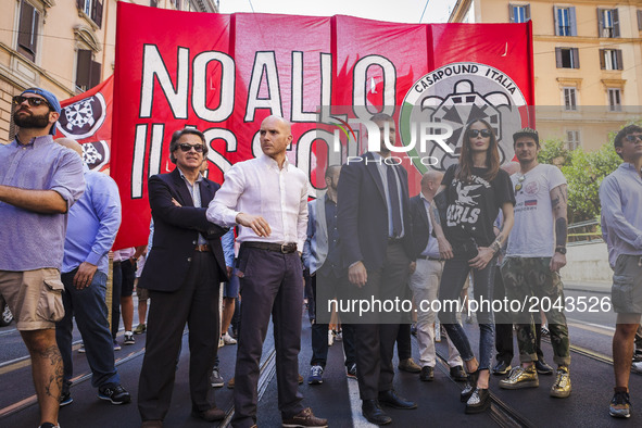 Simone Di Stefano(3L), Casapound Vice President, and Nina Moric (4L), a Croatian fashion model, march as thousands of members of Italian far...