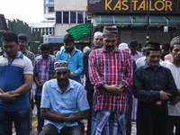 Indian Muslims in Malaysia perform a special prayer outside the Indian Muslim mosque during Eid-Fitri celebrations on June 25, 2017 in Kuala...