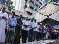 Indian Muslims in Malaysia perform a special prayer outside the Indian Muslim mosque during Eid-Fitri celebrations on June 25, 2017 in Kuala...