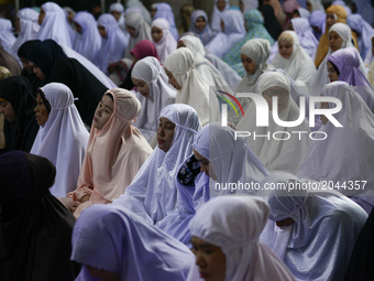 Thai Muslim women attend Eid al-Fitr prayers to mark the end of the holy fasting month of Ramadan in Bangkok, Thailand. June 25, 2017. (