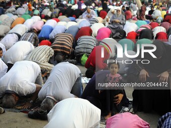  Egyptian Muslim men and women gather for a prayer during the Muslim holiday of Eid al-Fitr, inMostafa Mahmoud Mosque, Giza, Egypt, 25 June...