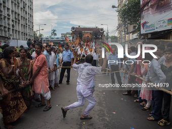 Volunteers are trying their best to keep the crowd away from the path during rath yatra in Kolkata, India, on 25.6.2017.Rath Yatra or the ca...