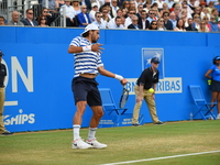 Spain's Feliciano Lopez returns against Croatia's Marin Cilic during the men's singles final tennis match at the ATP Aegon Championships ten...
