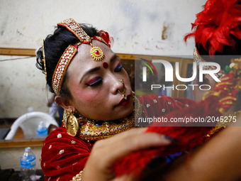 Nepalese transgender gets ready back stage for the first national dance competition for transgender in Kathmandu, Nepal on June 25, 2017. Th...