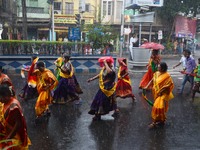 Indian Hindu  devotees  sing and dance in heavy rain during the annual Rath Yatra, or chariot festival, in Kolkata, India on Sunday,  25th J...