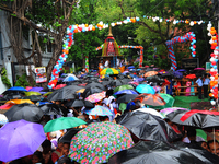 Heavy Rain Devotees take part in Jagannath Rath Yatra organised by ISKCON 46th Rath Yatra on June 25,2017 in Kolkata ,India.The three deitie...