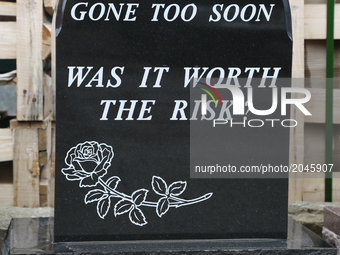 Newly made granite tombstone carved with a strange message outside the workshop of a tombstone designer in Mississauga, Ontario, Canada. (