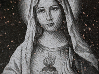 Etching of the Virgin Mary on a newly made granite tombstone outside the workshop of a tombstone designer in Mississauga, Ontario, Canada. (