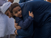 Little Muslim boy hugging each other after their religious Prayers of Eid al-fitr.Kolkata,India.26.6.2017.

 (