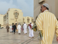 Moroccan Muslims on their way to celebrate Eid al-Fitr Prayer in Casablanca's Hassan II mosque. Muslims around the world celebrate Eid al-Fi...