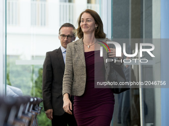 German Family Minister Katarina Barley (R) and Justice Minister Heiko Maas (L) arrive to a news conference regarding the evolution of the qu...