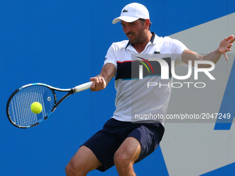 Julien Benneteau (FRA)   against Grigor Dimitrov BUL against during Round Two match on the third day of the ATP Aegon Championships at the Q...