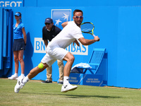 Viktor Troicki SRB ageinst Donald Young (USA) during Round Two match on the third day of the ATP Aegon Championships at the Queen's Club in...