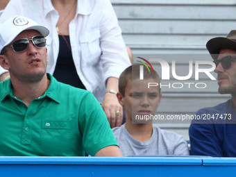 David Beckham and Romeo Beckham watching Sam Querrey (USA) during Men's Singles Round Two match on the fourth day of the ATP Aegon Champions...