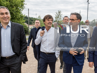 Mayor of the 4th district of Lyon David Kimelfeld (R) and French Minister of Ecological and Inclusive Transition Nicolas Hulot (C) during th...