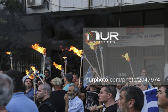 Hundreds of supporters of the nationalist Golden Dawn party held a torch-lit march in Thessaloniki, Greece on 25 June 2017, to protest again...