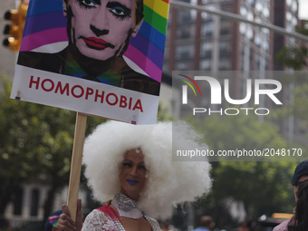 Participants during the LGBT Pride Parade in the city of New York in the United States this Sunday, 25.  (
