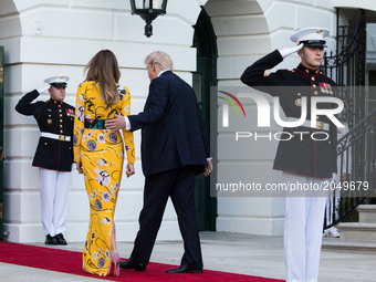 First Lady Melania Trump, and President Donald Trump head back in to the White House, after the departure of Prime Minister Narendra Modi of...