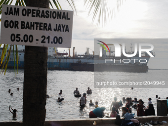 Activity in the last public beach, Bahtera Jaya, Jakarta on June 27, 2017. Bahtera is the remaining public beach without the sands. Here the...
