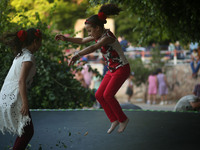 Palestinian children play in a park on the fourth day of Eid al-Fitr, which marks the end of the holy month of Ramadan. Eid al - Fitr holida...
