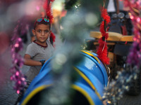 Palestinian children play in a park on the fourth day of Eid al-Fitr, which marks the end of the holy month of Ramadan. Eid al - Fitr holida...