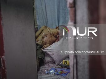 The body of one of two men killed by police following a police operation against illegal drugs in Caloocan, north of Manila, Philippines, Ju...