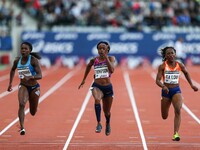 Jamaica's Elaine Thompson (C) competes during the women's 100 meters within the International Association of Athletics Federations (IAAF) Di...