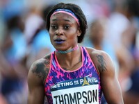 Jamaica's Elaine Thompson (C)  gestures after winning the women's 100 meters within the International Association of Athletics Federations (...