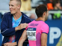 USA's Sam Kendricks (L) comforts France's Renaud Lavillenie (R) after a jump in the Pole Vault event of the International Association of Ath...