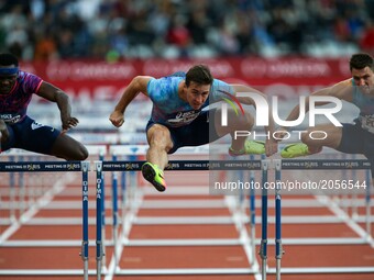 Omar Mc Leod (L) of Jamaica, Sergey Shubenkov (C) of Russia and Andrew Pozzi (R) of Great Britain  compete during the men's 110 meters hurdl...