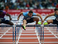 Omar Mc Leod (L) of Jamaica, Sergey Shubenkov (C) of Russia and Andrew Pozzi (R) of Great Britain  compete during the men's 110 meters hurdl...