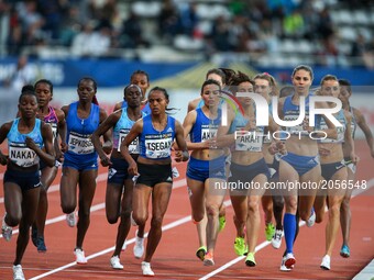 Athletes compete during the women's 1500 meters within the International Association of Athletics Federations (IAAF) Diamond League in Paris...