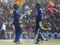 Sri Lankan cricket captain Angelo Mathews(R) and Upul Tharanga congratulate each other after securing the victory during the 2nd One Day Int...