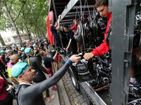 An athlete deposits his clothes during the 2017 edition of the Paris triathlon on July 2. 2017 in Paris. An unprecedented course located ami...