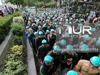 Athletes wait for the swim section of the 2017 edition of the Paris triathlon on July 2. 2017 in Paris. An unprecedented course located amid...