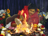 Her Holiness Amma Sri Karunamayi performs special prayers during the Homa (sacred fire ceremony) at the Bhuvaneswari Amman Temple in Brampto...
