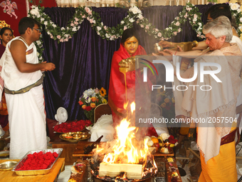 Her Holiness Amma Sri Karunamayi along with Hindu priests perform special prayers during the Homa (sacred fire ceremony) at the Bhuvaneswari...