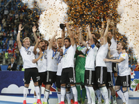 Germany national team players celebrate with the trophy during award ceremony after FIFA Confederations Cup Russia 2017 final match between...